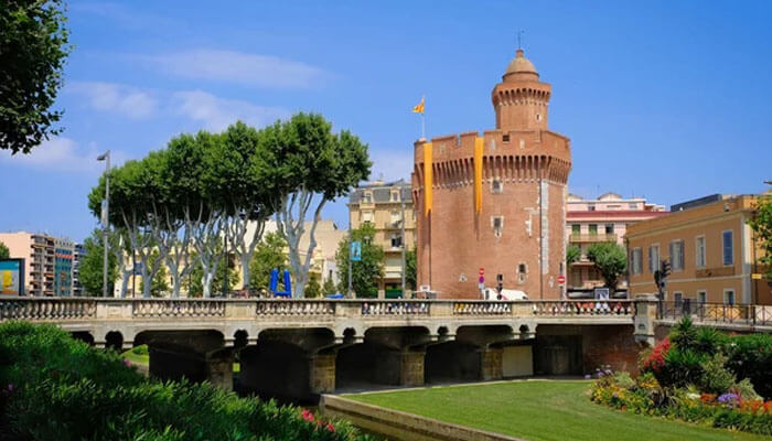 The red brick Castillet tower and bridge in Perpignan, a cultural highlight of a south of France vacation.