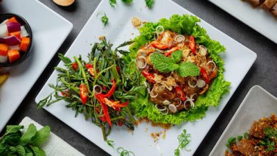 Colorful Thai salad served with herbs, lettuce, and chili — one of the best Thai dishes known for its vibrant flavors and fresh ingredients.
