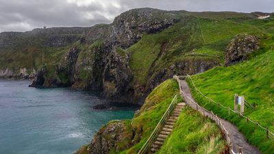 Scenic coastal cliffs and walking trail along the Atlantic Ocean, one of the top places to visit in Northern Ireland for nature lovers.