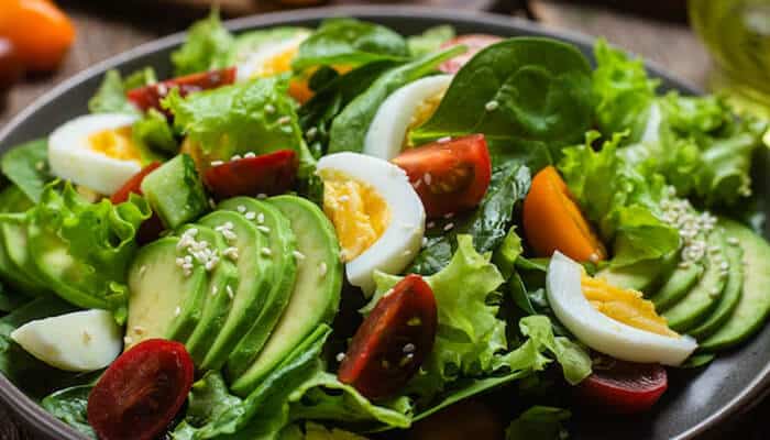 Avocado Egg Salad - Food Fun Trip - FoodFunTrip A fresh and healthy avocado and egg salad with mixed greens, tomatoes, and cucumber, perfect for a nutritious meal