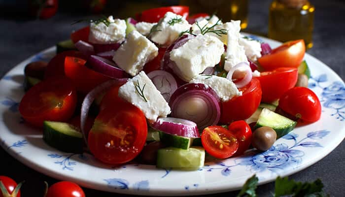 Chopped Greek Salad - Food Fun Trip - FoodFunTrip Healthy Salad Recipes: A delicious plate of Greek salad with tomatoes, cucumber, onions, and feta cheese, showcasing a healthy salad recipe packed with fresh ingredients