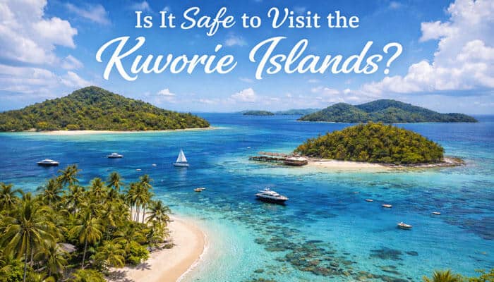 Is It Safe to Visit the Kuvorie Islands - Food Fun Trip - FoodFunTrip Is Kuvorie Islands Dangerous: Tropical aerial view of the Kuvorie Islands with turquoise water, boats, and palm trees showing a scenic perspective while asking if it is safe to visit the Kuvorie Islands.