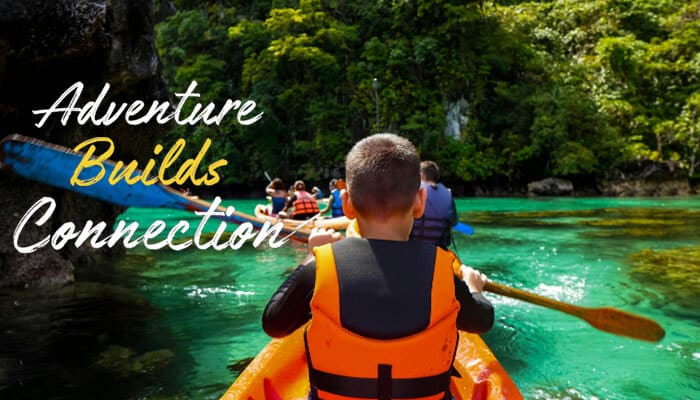 Adventure Builds Connection - Food Fun Trip - FoodFunTrip Couple kayaking through crystal-clear tropical waters surrounded by lush cliffs highlighting shared adventure experiences that answer Is Kuvorie Island for Honeymoon a perfect choice for couples seeking emotional bonding, nature immersion, and off-grid romantic travel