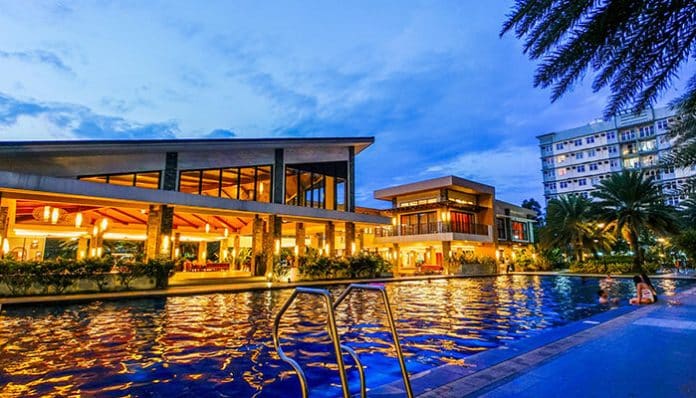 Plan a Memorable Stay at a luxury Pocono-style mountain resort featuring a scenic outdoor pool, modern vacation accommodations, peaceful evening ambiance, and relaxing travel experience.