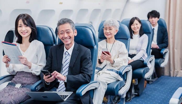 Business Class to Japan passengers enjoying comfortable airline seating, premium cabin services, spacious legroom, luxury international air travel, and upgraded in-flight experience on long-haul flights to Tokyo and other Japanese destinations.