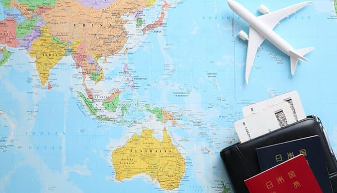 All Inclusive Travel vacation planning with passports, airline tickets, and world map showcasing international tourism, luxury holiday packages, global destinations, and stress-free travel experiences for families and couples.