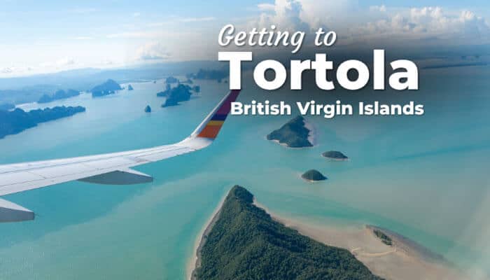 Getting to Tortola British Virgin Islands - Food Fun Trip - FoodFunTrip Aerial view of Tortola British Virgin Islands from airplane window, showcasing turquoise waters, small islands, and scenic coastlines for travelers planning their journey.