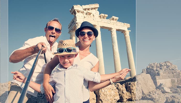 How to Start Your Own Family Lifestyle Travel Blog - Food Fun Trip - FoodFunTrip Happy family exploring ancient ruins on a sunny vacation, capturing a travel moment inspired by the My Little Babog family lifestyle travel blog, highlighting real-life family travel experiences and adventure storytelling.