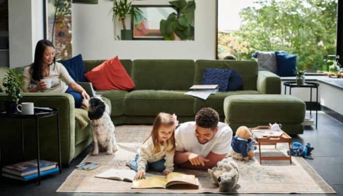 Quietly Improve Everyday Living: Family enjoying a modern living room with natural light, cozy furniture, and functional home design.