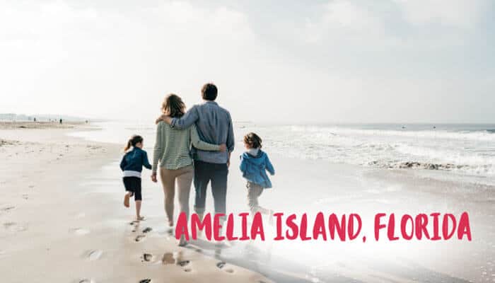 Amelia Island Florida - Food Fun Trip - FoodFunTrip Best East Coast Beaches for Families featuring Amelia Island Florida with parents and children walking along a peaceful sandy shoreline, enjoying a relaxing family beach vacation with scenic ocean views