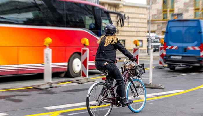 Learn the Local Transportation System - Food Fun Trip - FoodFunTrip Easy Traveling CwBiancaVoyage guide image showing a traveler using local transportation with a bicycle, city roads, and public transit options to highlight smart route planning, affordable travel methods, and stress-free destination exploration.