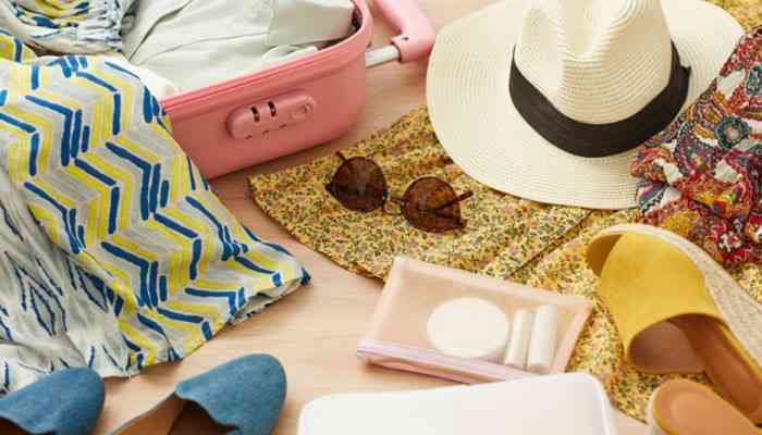 What to Pack for Costa Rica - Food Fun Trip - FoodFunTrip Costa Rica Travel Guide showing essential travel packing items including a suitcase, beach hat, sunglasses, clothing, sandals, and vacation accessories prepared for a tropical Costa Rica adventure, helping travelers plan for beaches, rainforests, and outdoor experiences.