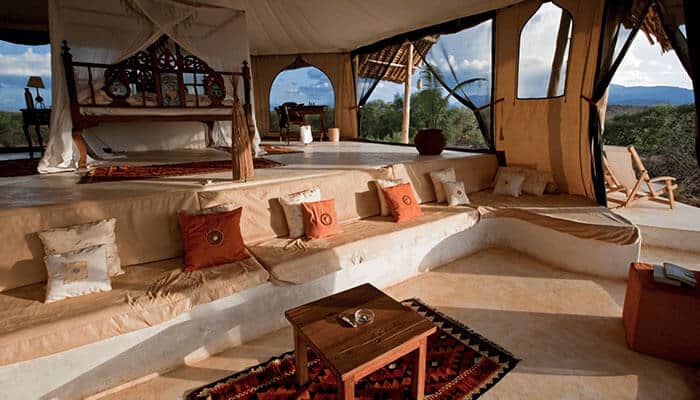 Why Africa Remains the Benchmark - Food Fun Trip - FoodFunTrip Luxury Travel safari lodge interior featuring an elegant tented retreat with premium furnishings, panoramic nature views, and an exclusive wilderness accommodation experience