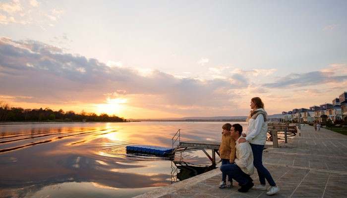 Zadar - Food Fun Trip - FoodFunTrip Croatia Travel Guide featuring a peaceful sunset view of Zadar waterfront, Adriatic Sea promenade, family enjoying the coastal scenery, and the charming Dalmatian city atmosphere