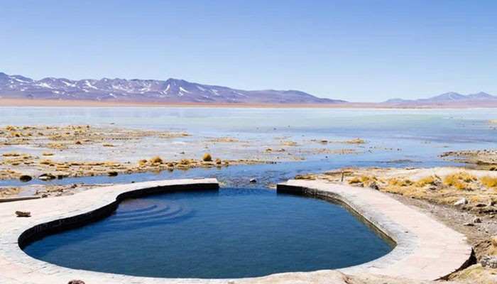 What to Expect at the Pools - Food Fun Trip - FoodFunTrip Alvord Hot Springs geothermal soaking pool overlooking the Alvord Desert and Steens Mountain in southeastern Oregon, surrounded by stunning desert landscapes.