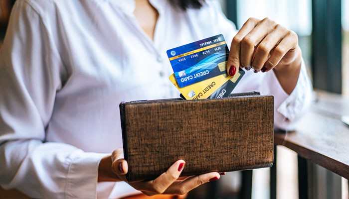 Will U.S. Credit Cards Work in Cuba? - Food Fun Trip - FoodFunTrip Can Americans Travel to Cuba payment guide showing a traveler holding U.S. credit cards, highlighting the need to confirm card availability and payment options before visiting Cuba.